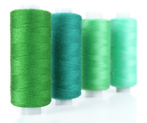 Colored spools of threads isolated on white