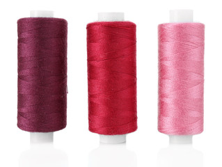 Colored spools of threads isolated on white