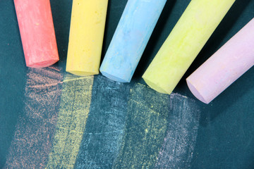Colorful chalks on school desk