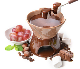 Chocolate fondue with fruits, isolated on white