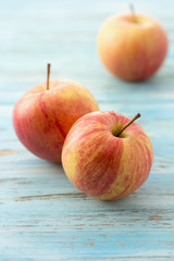 Red apple fruit, on wooden table