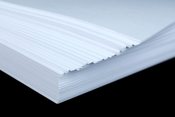 White paper on black background close-up