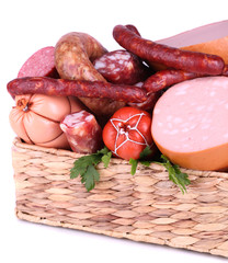 Lot of different sausages in basket isolated on white