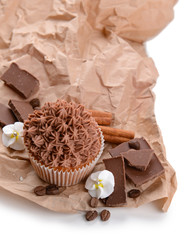 Tasty cupcake with butter cream, with decorations, isolated