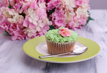 Tasty cupcake with butter cream,