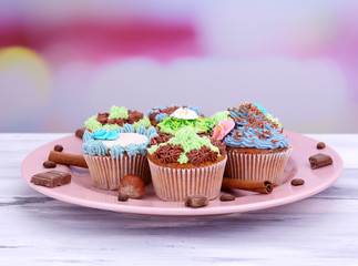Tasty cupcakes with butter cream,