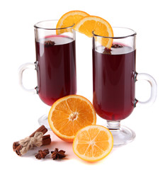 Mulled wine with oranges and spices isolated on white