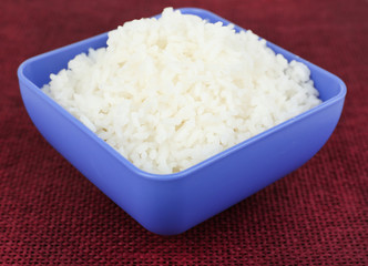 Cooked rice in bowl on table close up