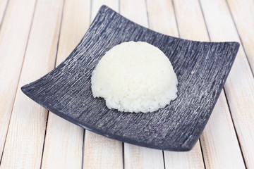 Cooked rice on wooden table