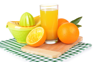 Citrus press and oranges isolated on white