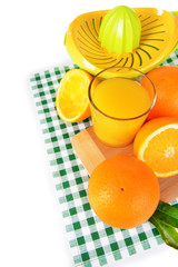 Citrus press and oranges isolated on white