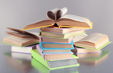 Naklejka premium Stacks of books on grey background
