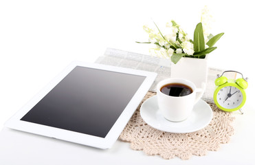 Tablet, newspaper, cup of coffee and alarm clock, isolated