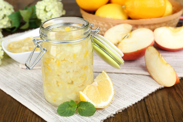 Tasty lemon jam on table close-up