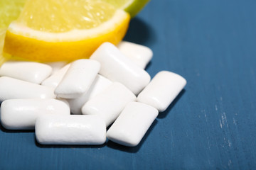 Chewing gums with fruit taste,   on color wooden background