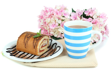 Cup of tea and sweets isolated on white