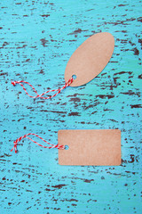 Set of tags on color wooden background