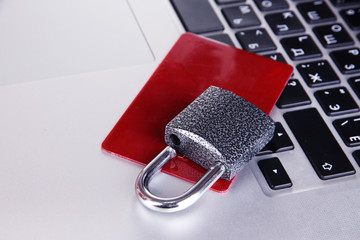 Credit card and lock on keyboard close up