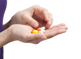 Pills on the hand. Herbal remedy, isolated on white