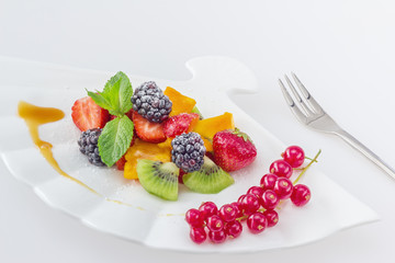 Diet, healthy colorful fruit salad in the white plate