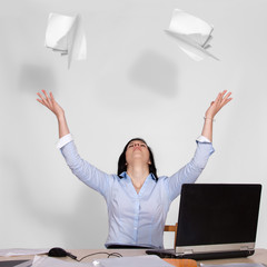 Woman throws out paper into the air