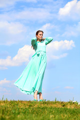 Obraz premium Young woman in green dress