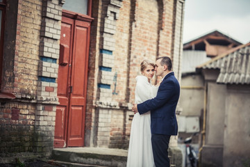 wedding. couple embracing in city