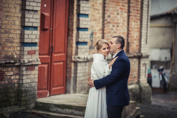 wedding. couple embracing in city