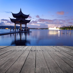 pavilion at nightfall in west lake ，hangzhou ，China