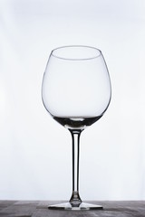 Empty wineglass on white