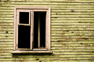 Obraz na płótnie Canvas window in an abandoned house
