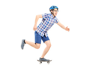 Young man with helmet riding a small skateboard