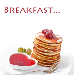 Delicious pancakes with strawberry jam