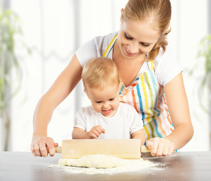 baby girl with her mother cook, bake