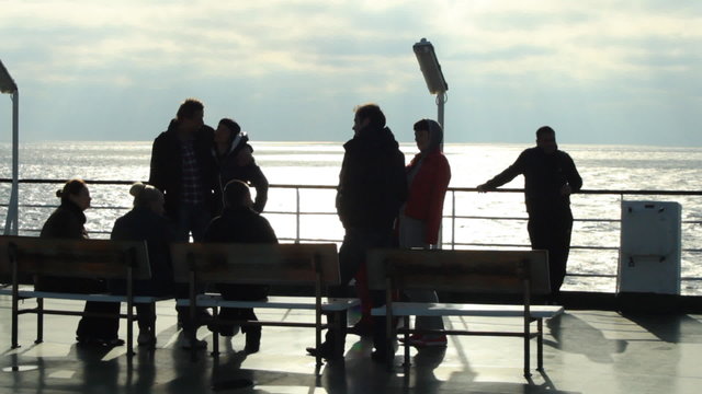 passengers on the deck of the ferry