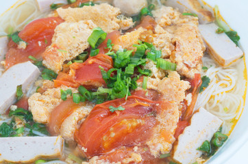 Bun Rieu Meat rice vermicelli soup, served with tomato broth and