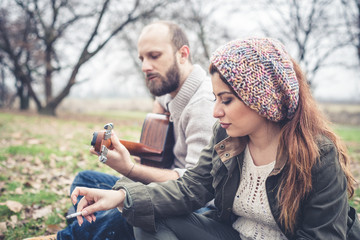 couple in love playing serenade with guitar