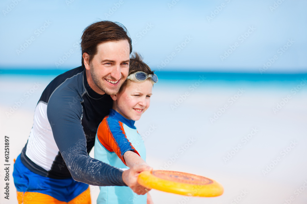 Wall mural father and son playing frisbee