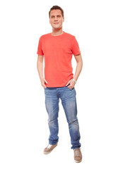 Young man guy red t-shirt jaens with hands in pockets isolated