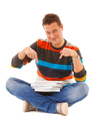 Man college student sitting and showing offering books isolated