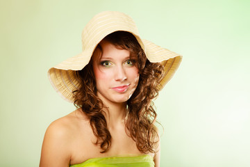 Spring or summer. Young woman girl in hat and green dress