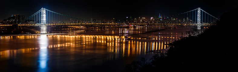 Geoege Washington Bridge and the New York skyline by night