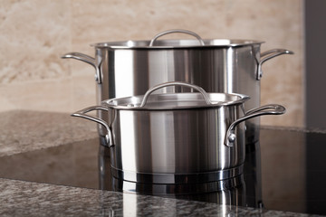 Two aluminum pots on induction hob