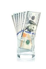 One hundred dollars pile in galss