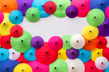 Fototapeta na wymiar Colorful Thai traditional handmade umbrellas background with spa