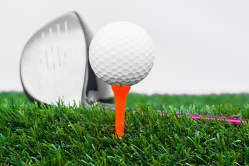 Close up of golf ball and tee with the driver