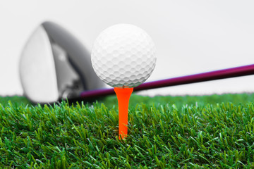 Close up of golf ball and tee with the driver
