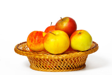 Many apples in a straw basket