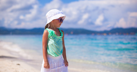 Beautiful little girl having fun on an exotic beach