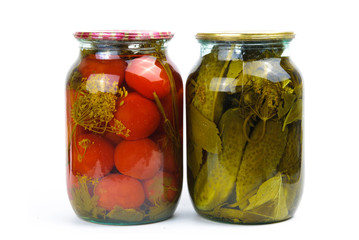 Two glass jars of colorful pickled vegetables